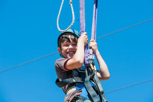 Boy smiling on Giant Swing