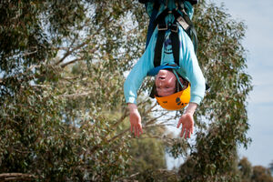 Child upside on Giant Swing