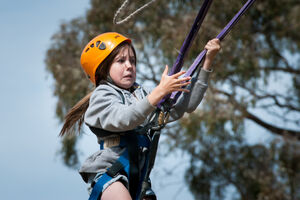 Girl surprised once pulling release cord on Giant Swing