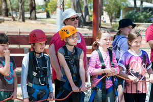 Group of children on Giant Swing pull team