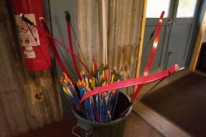 Red bows and coloured arrows in bucket