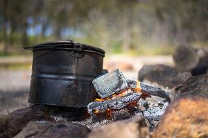 Billy tea boiling on a campfire