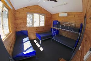 Timber style cabin with bunk and single beds