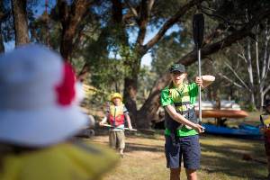 Activity instructor teaching students about padding