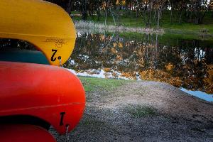 Canoes stacked next to dam