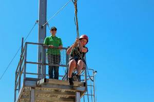 Student jumping off flying fox platform