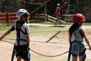 Two students ready to run on the giant swing pull team