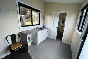 Kitchenette and Bathroom in Tiny House at Log Cabin Homestead Creswick