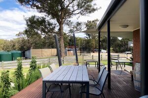 Outdoor seating at Log Cabin Homestead Creswick