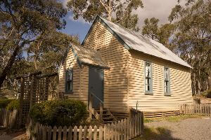 Small cream white chapel in bush setting