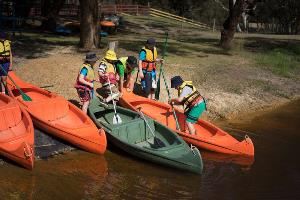 Students getting ready to launch canoes